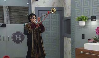 Derek Xiao blowing a trumpet Big Brother Season 23