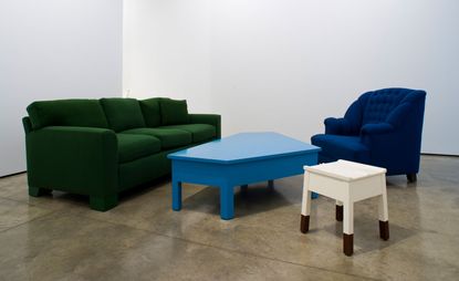 Green and blue sofa with blue and white coffee table