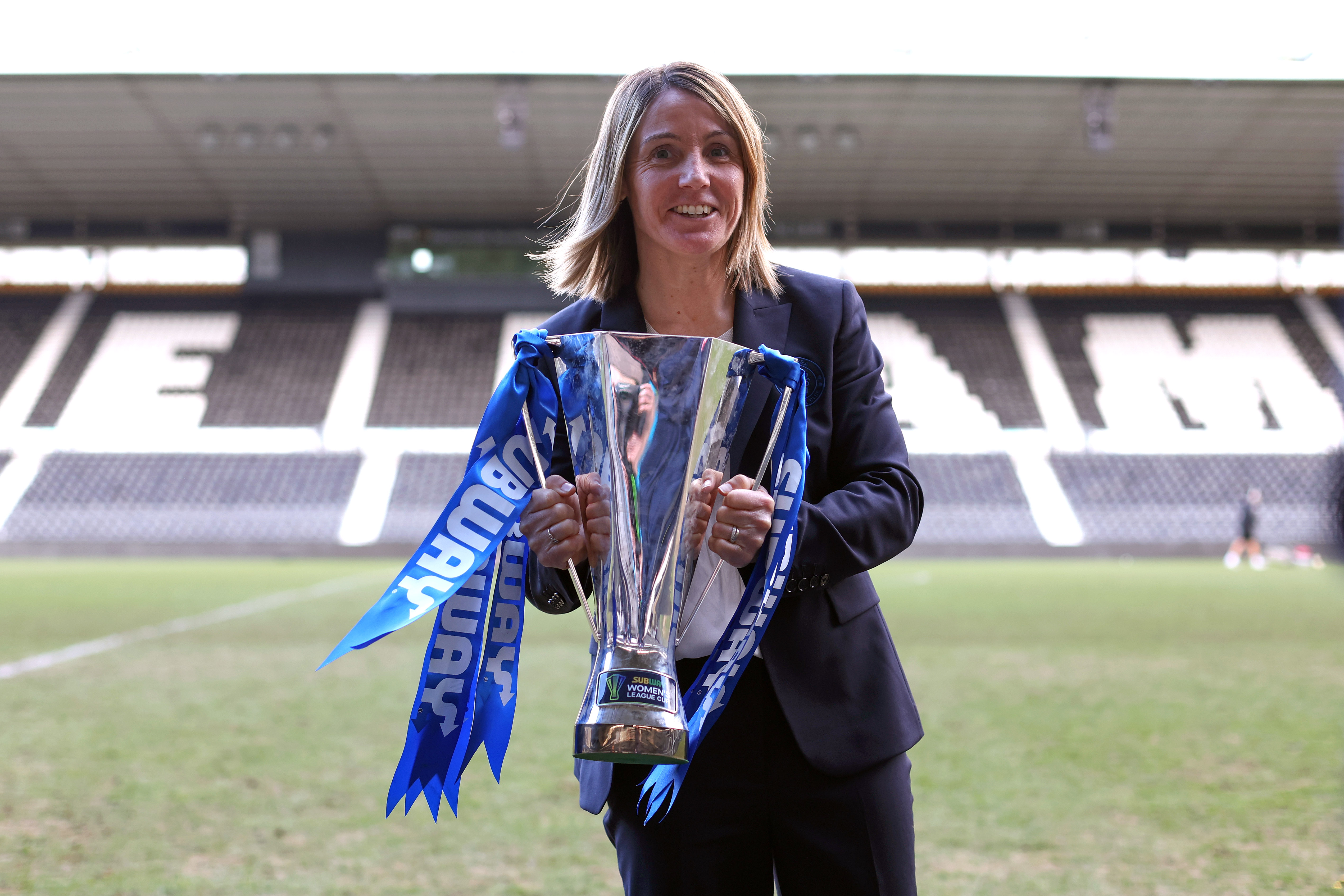 DERBY, ENGLAND - MARCH 15: Chelsea manager Sonia Bompastor with the trophy during the Subway Women&#039;s League Cup Final match between Chelsea and Manchester City at Pride Park on March 15, 2025 in Derby, England.
