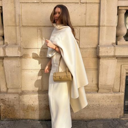 Lovisa Barkman in a white cape top and Chanel bag