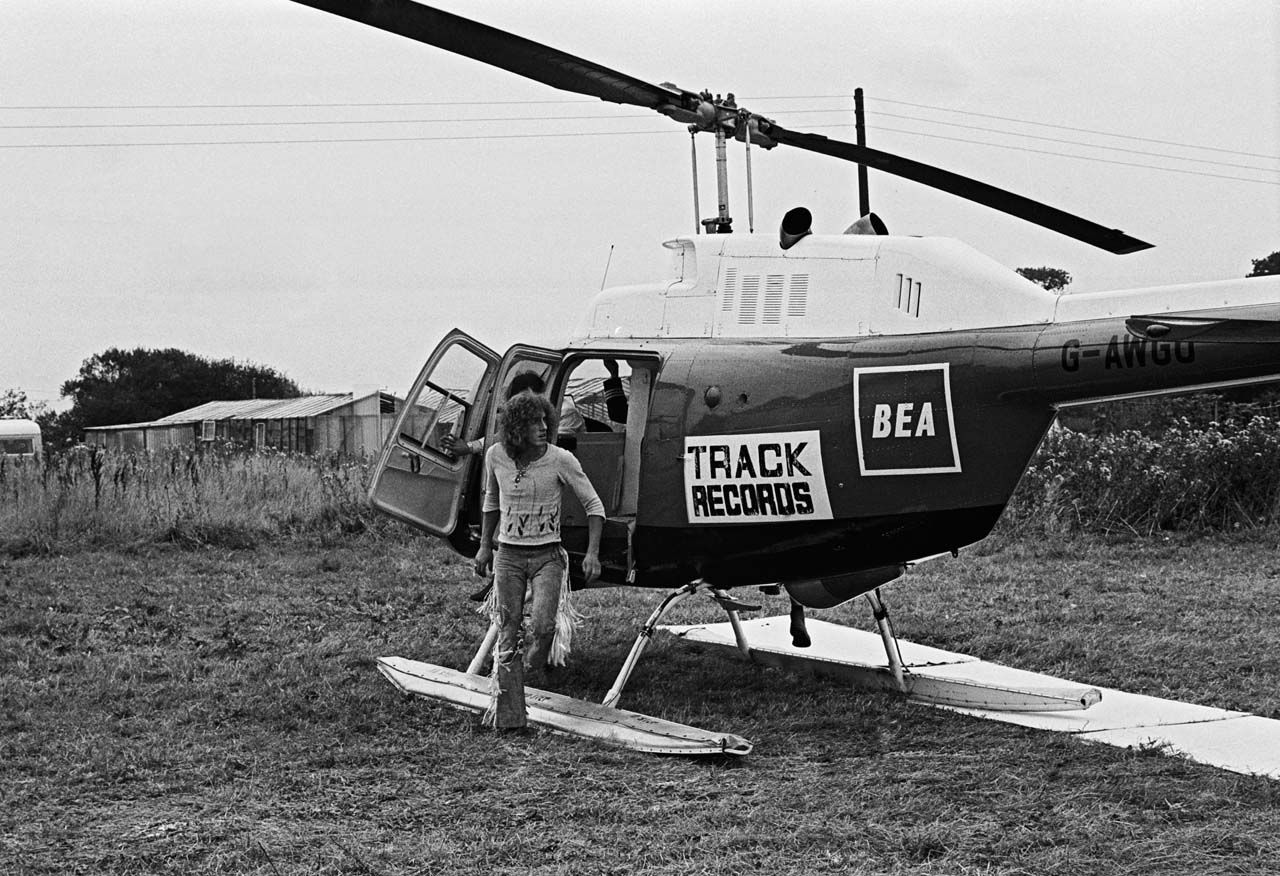 Roger Daltrey arrives on the Isle Of Wight in a helicopter emblazoned with his The Who's record company logo