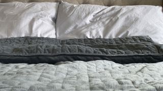 Should I get a weighted blanket for anxiety? image shows weighted blanket on bed