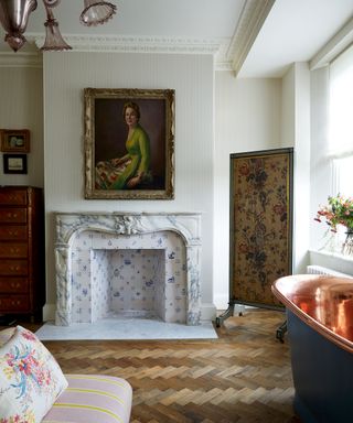 Traditional style bedroom and bathroom with tiled fireplace