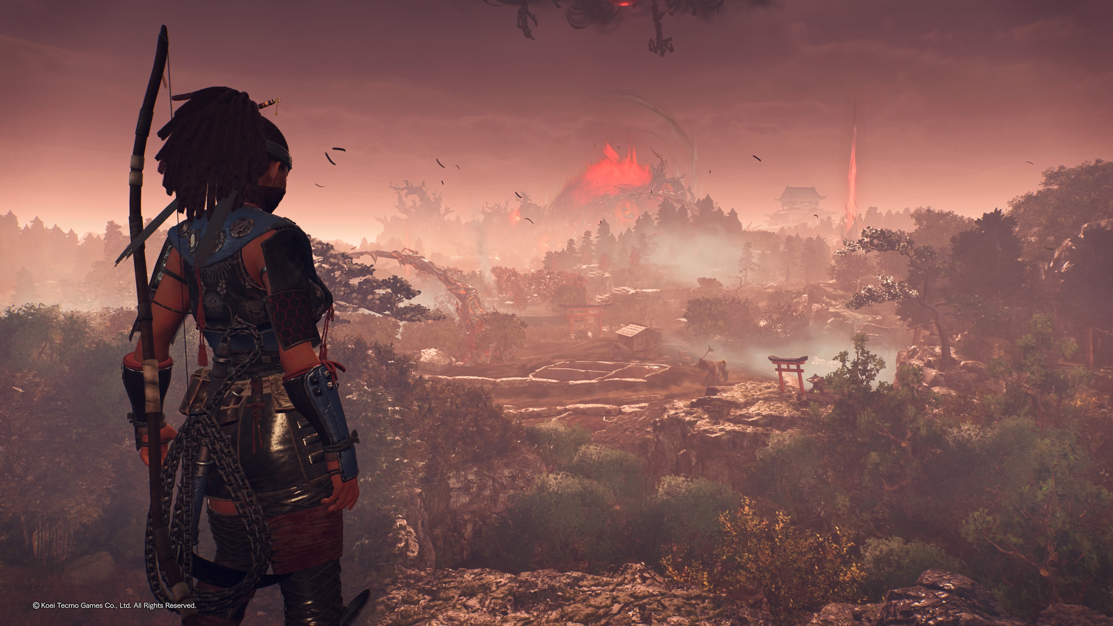 The player looks out across the open world in the Nioh 3 Alpha, with the Crucible in the distance