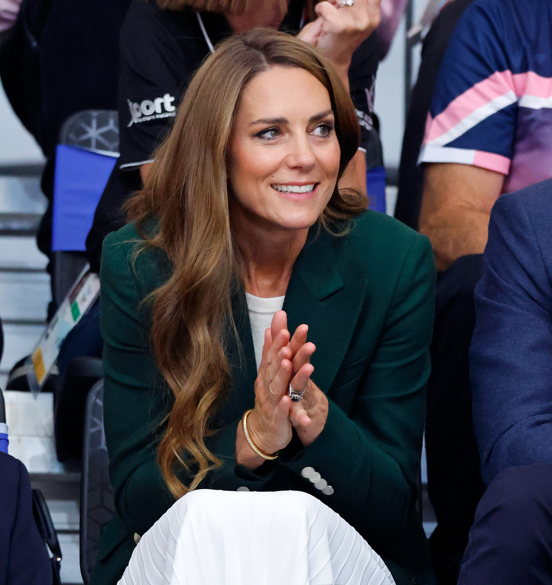 Princess Kate leaning forward in a seat at the Commonwealth Games