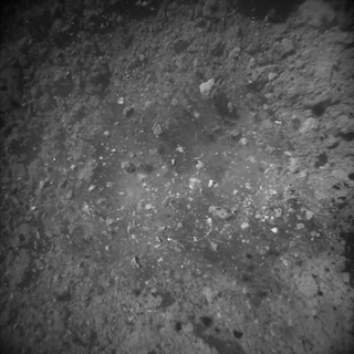 The navigation camera on Hayabusa2 captured this image of the surface of Ryugu during the sampling touchdown conducted on July 10, 2019.