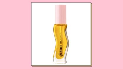 The Gisou Honey-infused lip oil/ in a pink template
