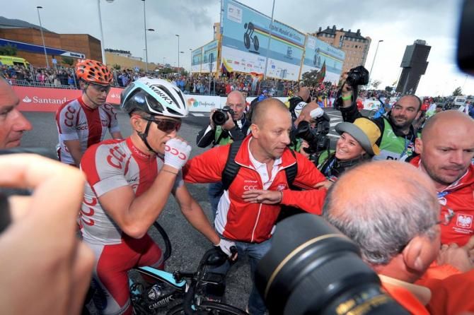 Michal Kwiatkowski (Poland) swarmed by photographers after his big win