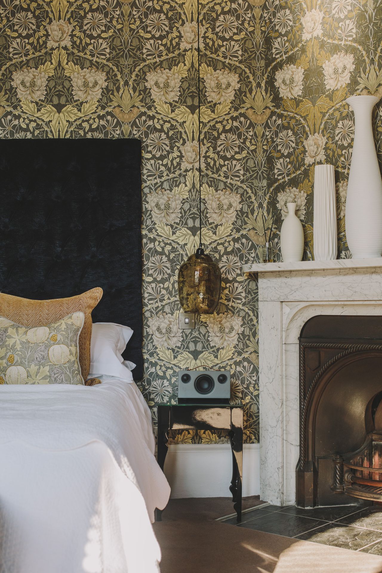 A William Morris-inspired, crafty hotel features rooms plastered in floral wallpapers, organic sculptures, and vibrant textiles.