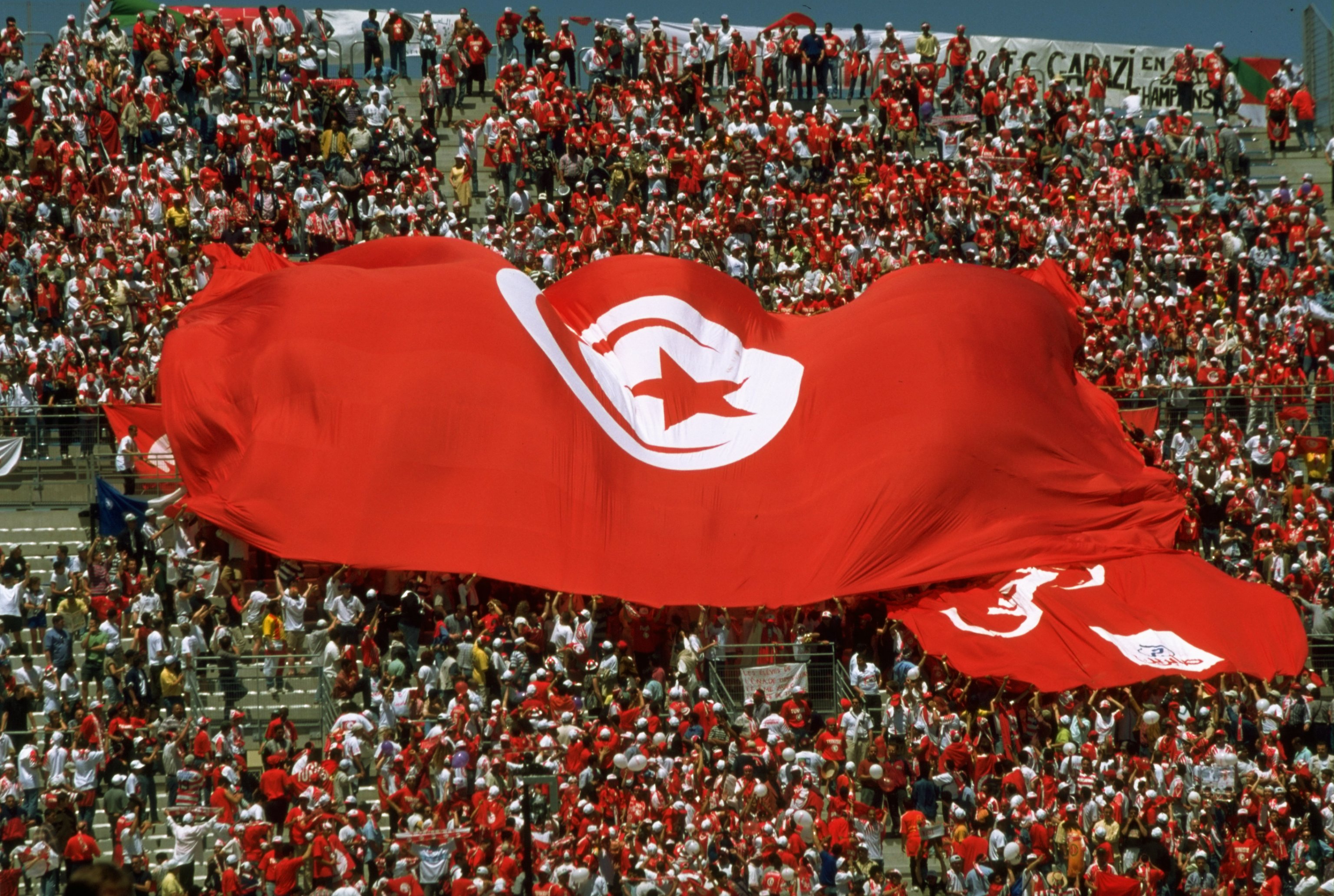 Tunisia fans unfurl a huge national flag during their World Cup game against England in June 1998.