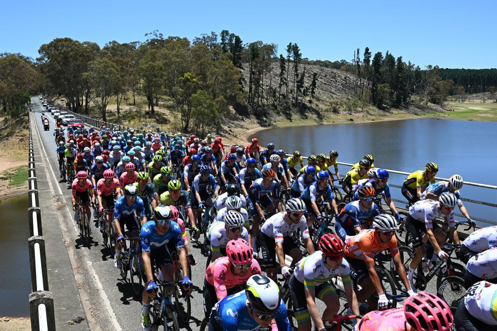Peloton races over one of the many reservoirs on stage 3