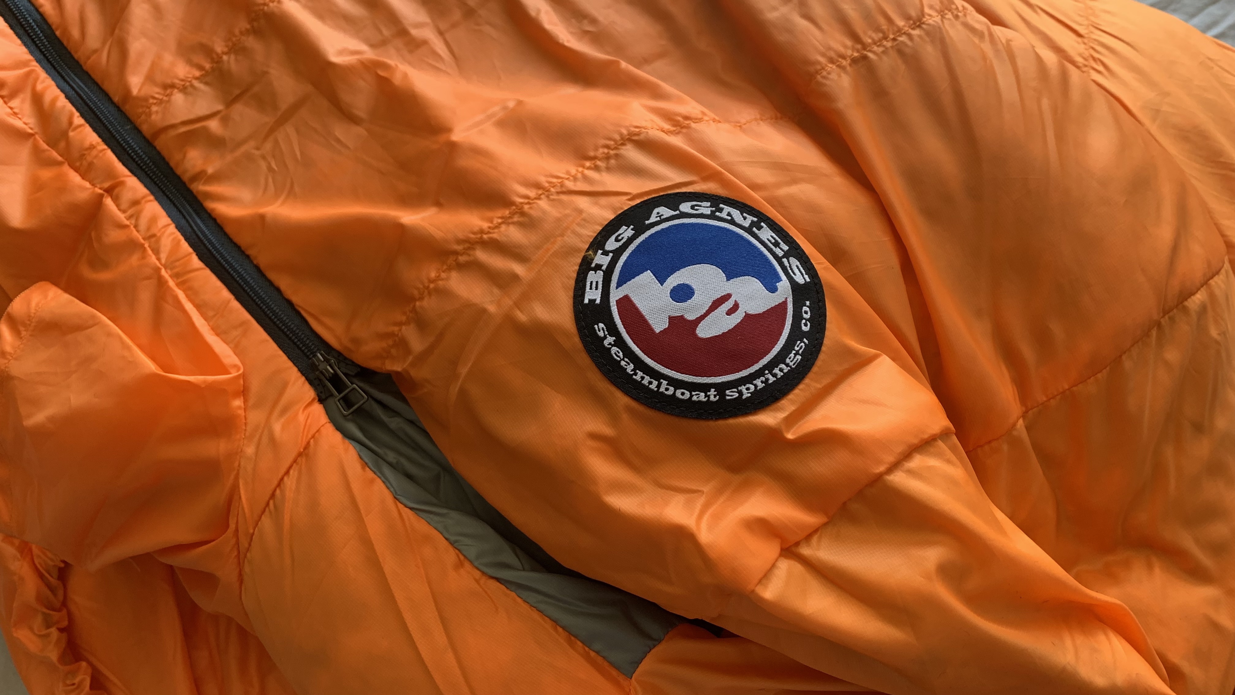 Big Agnes logo on orange Torchlight EXP 0 sleeping bag