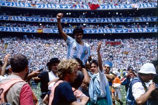 Hector Enrique celebrates with fans after Argentina's World Cup final win over West Germany in 1986.