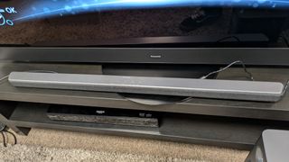 Philips TAB6309 soundbar on stand under TV