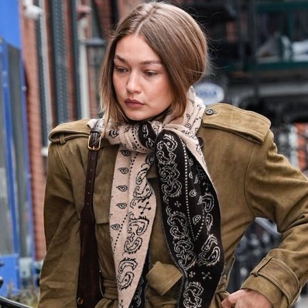 Gigi Hadid revived Fall 2025's suede trench coat trend with straight-leg jeans and leather loafers