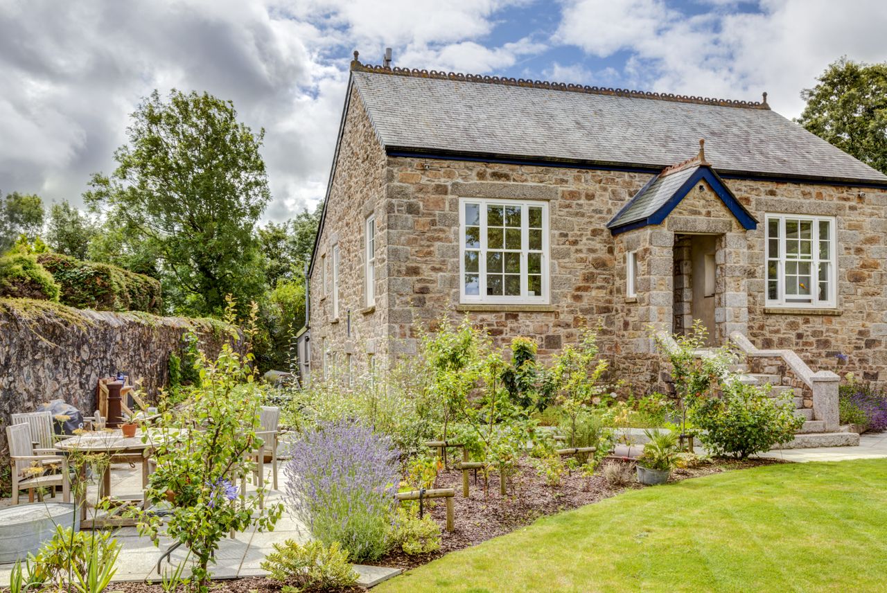 How to project manage an extension or renovation: Exterior of renovated school house and garden