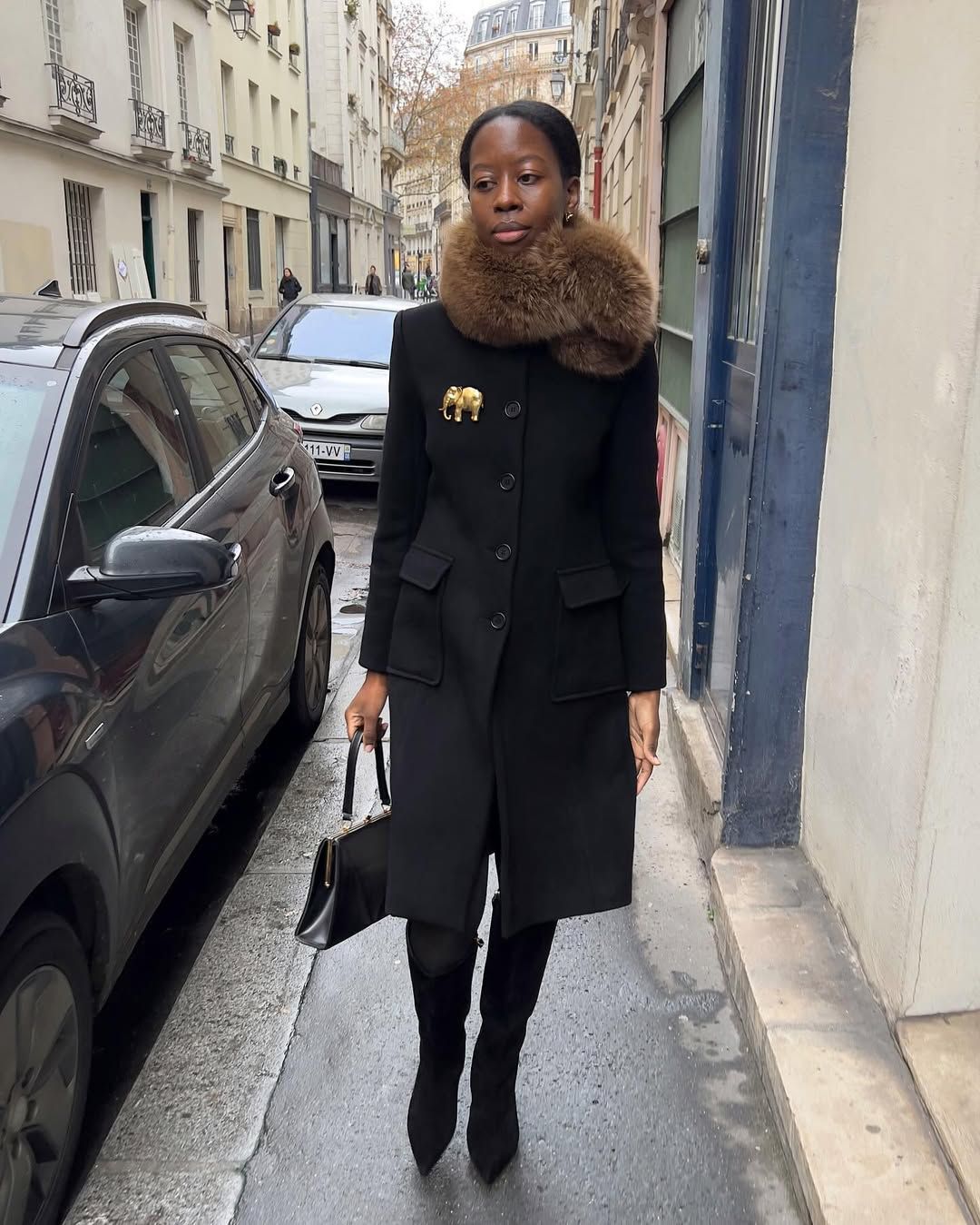 Sylvie Mus wearing a faux-fur scarf.
