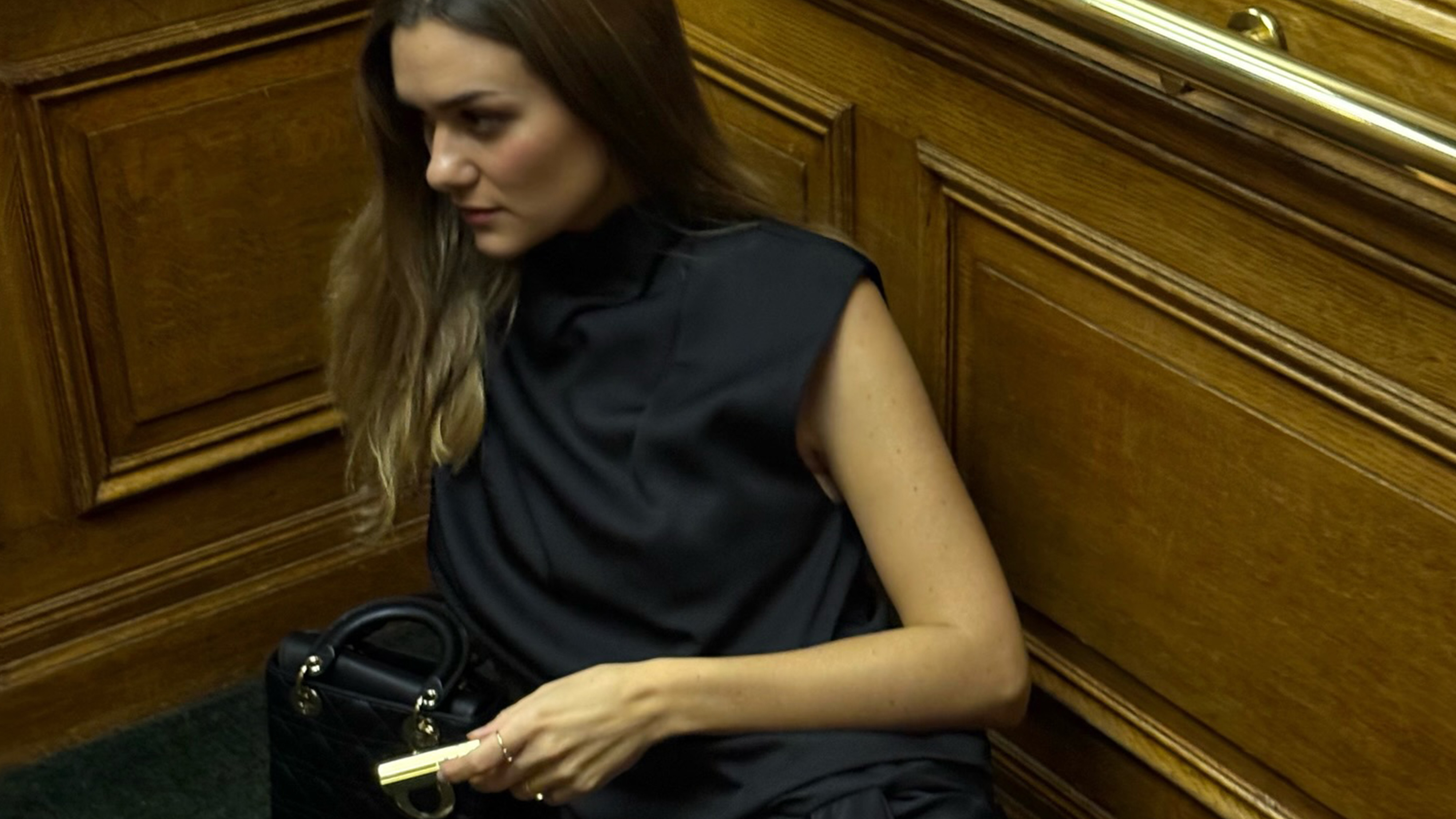 Anne Laure Mais wearing a draped dress.