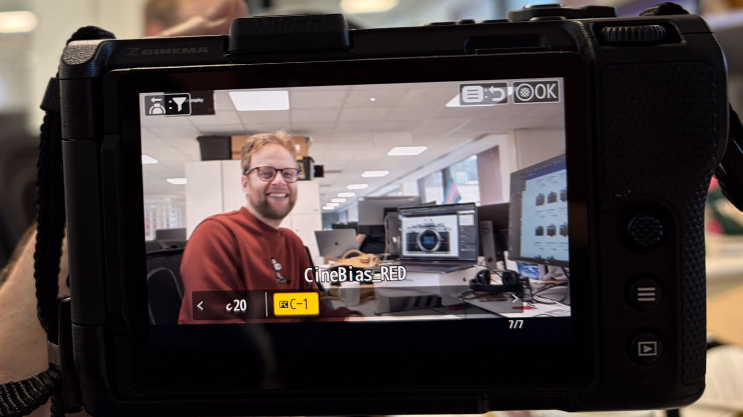 Person holding a Nikon ZR with Z 28-135mm f/4 PZ lens