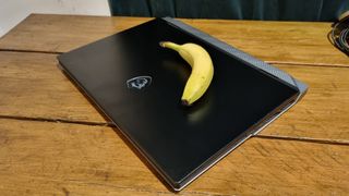 MSI Titan 18 HX, with banana, in repose.