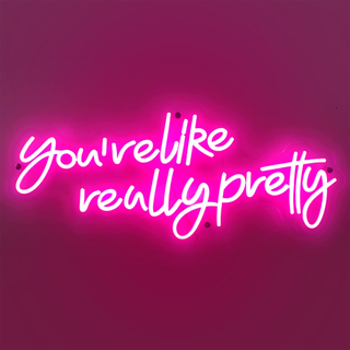 A pink neon sign reading 