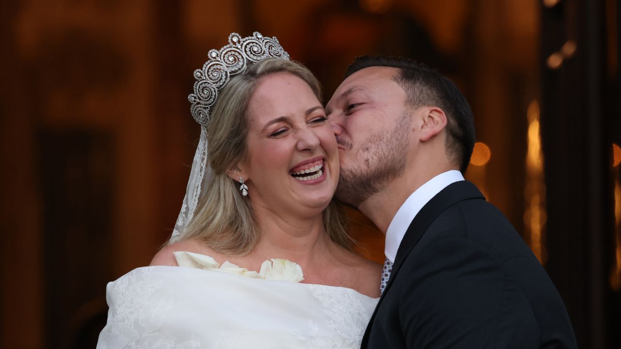 Theodora of Greece and Matthew Kumar kiss following their wedding ceremony at the Cathedral of the Annunciation of St. Mary in Athens, Greece on September 28, 2024