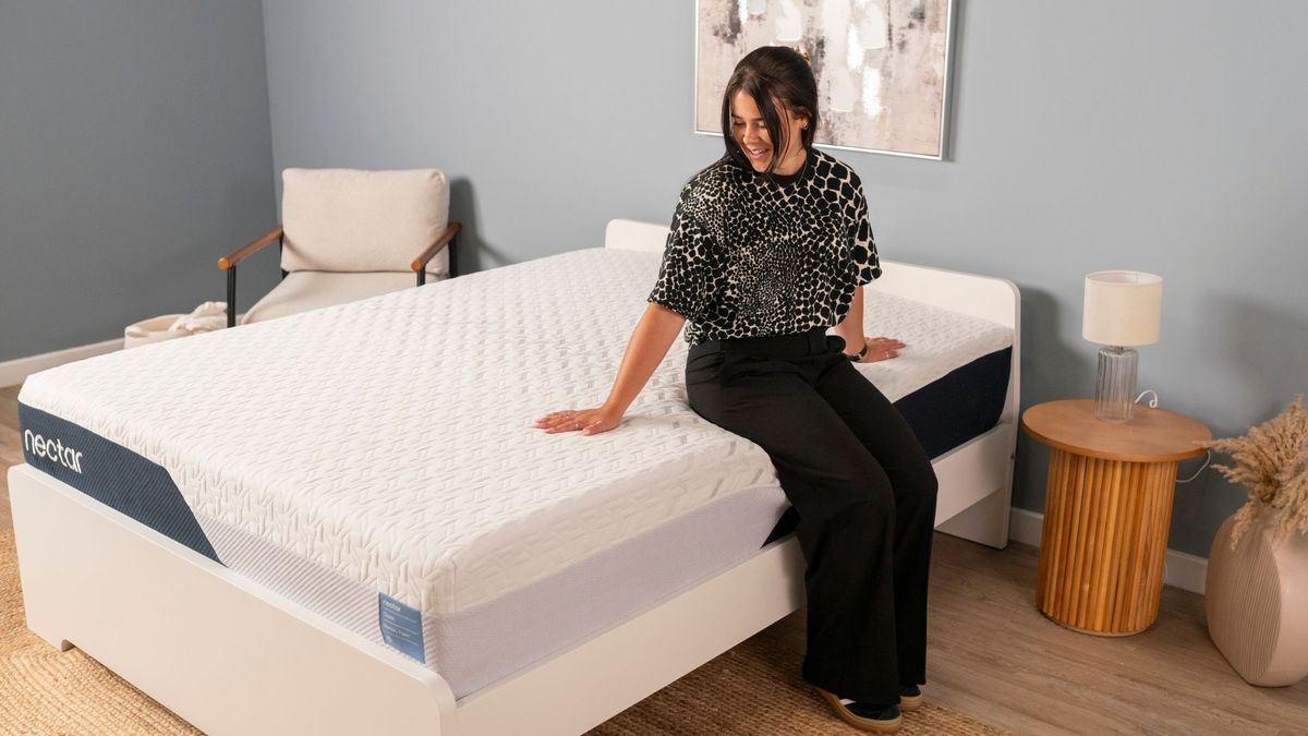 A member of Tom&#039;s Guide&#039;s testing panel sits on the edge of the Nectar Classic Memory Foam Mattress