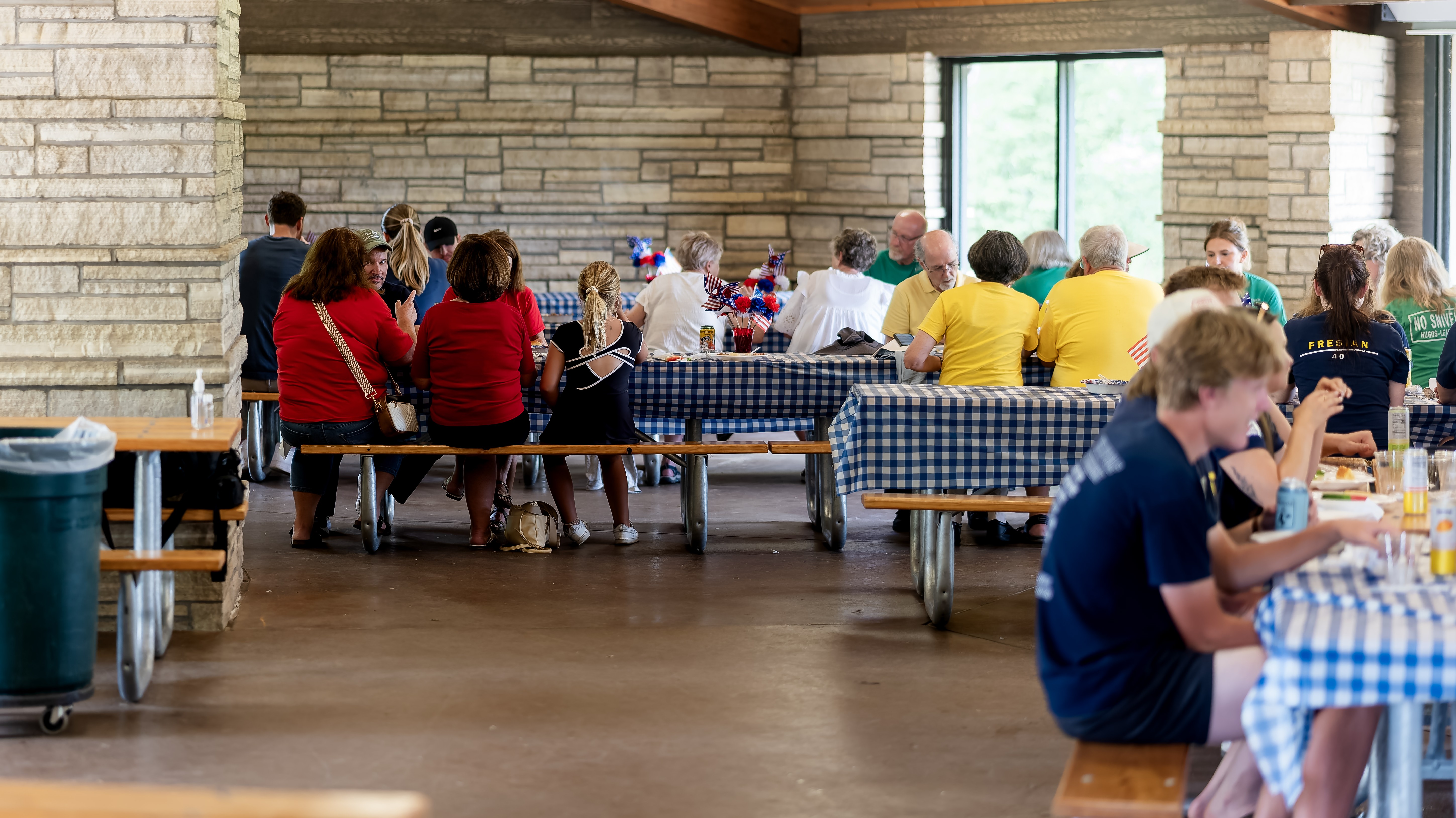 A large group of the author's relatives eating and talking at a family reunion.