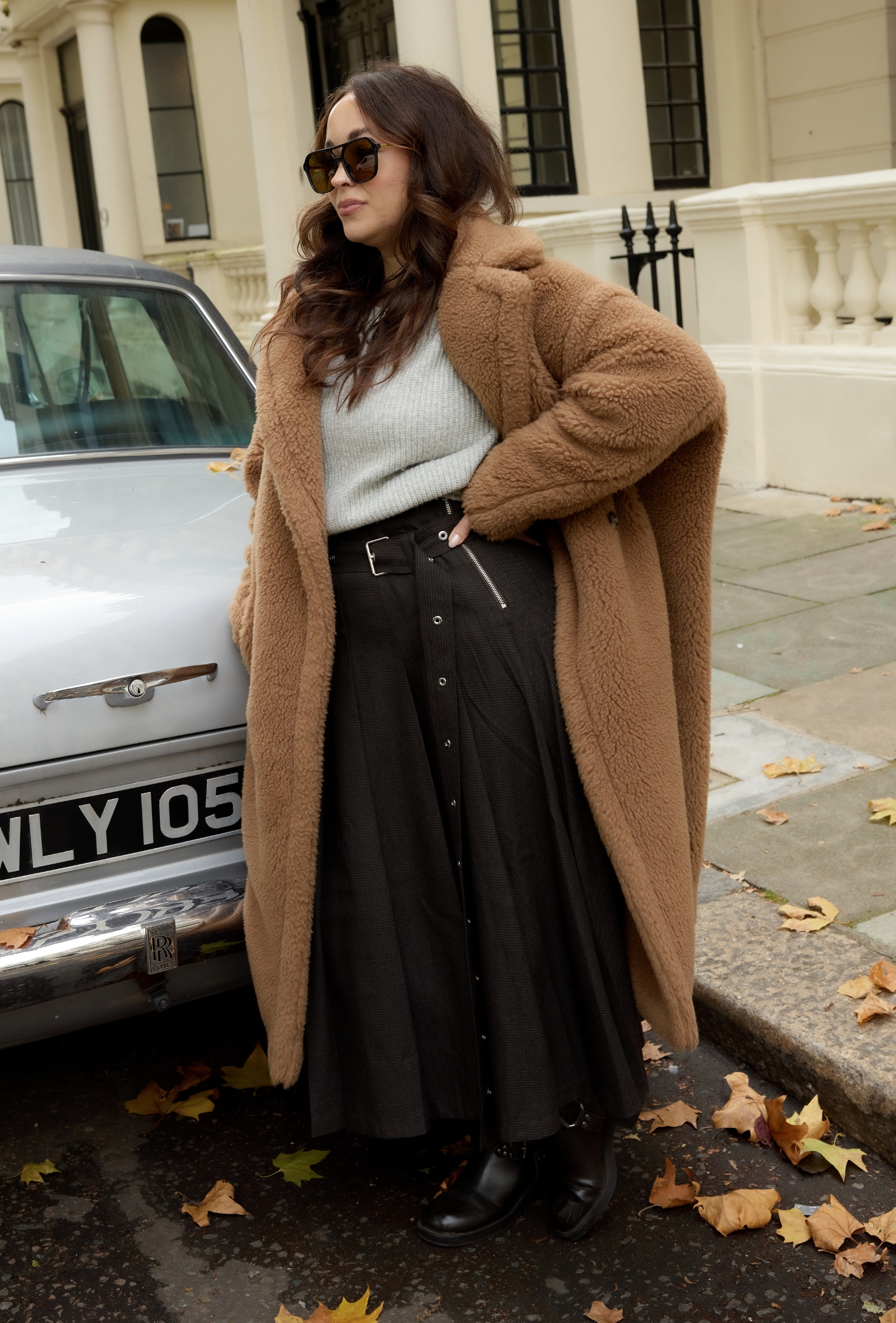 An editor from Who What Wear UK modelling a teddy coat