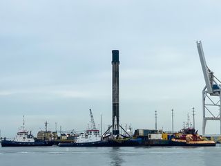 SpaceX's first Falcon 9 booster to fly six times returns home to Port Canaveral in Cape Canaveral, Florida on Aug. 21, 2020 atop the drone ship landing platform Of Course I Still Love You. The rocket launched 58 Starlink satellites and three Planet SkySats from Cape Canaveral Air Force Station on Aug. 18. 