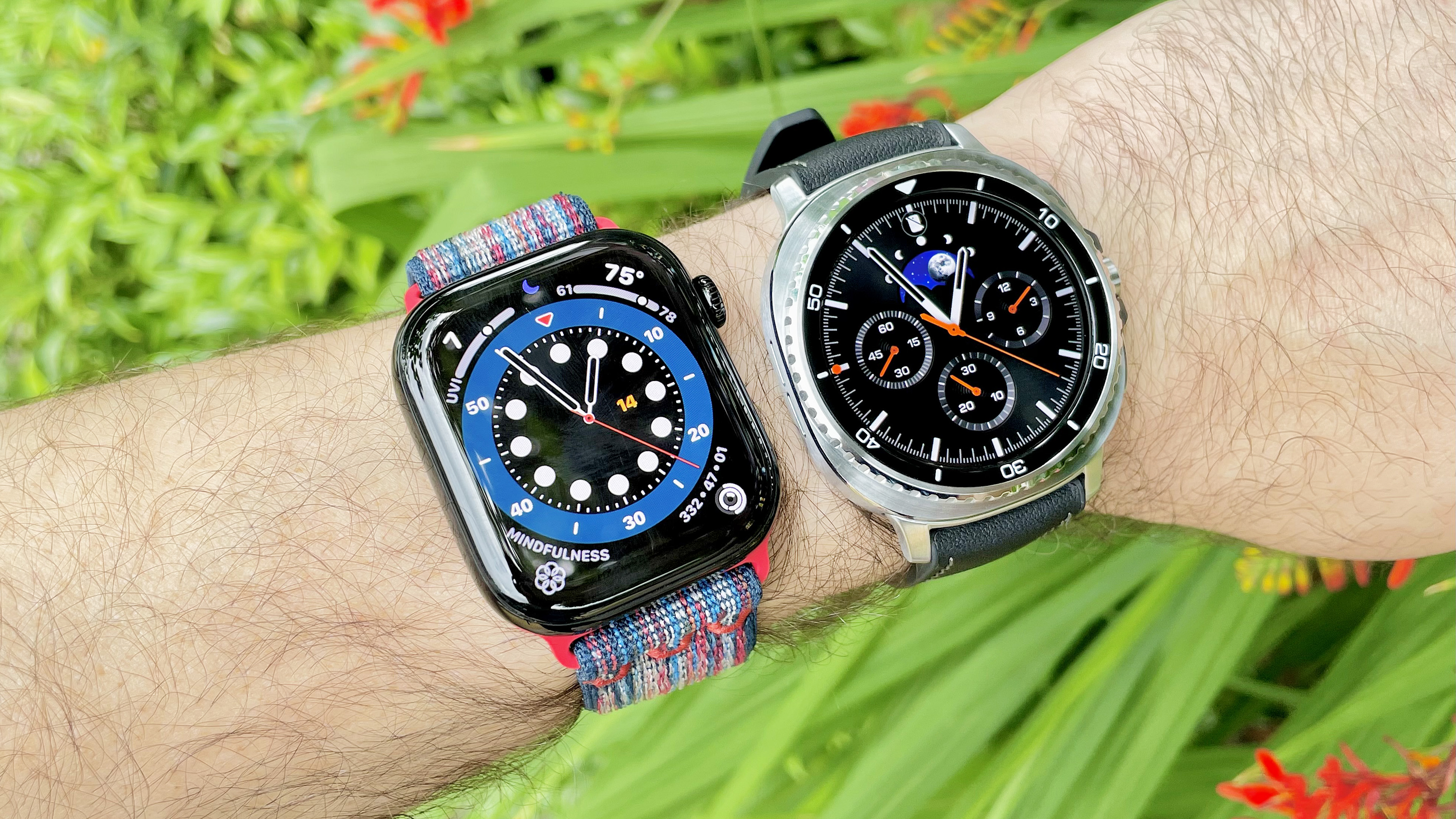 Close up of the Samsung Galaxy Watch Ultra 8 and Apple Watch Series 10 next to each other against a green, foliage background