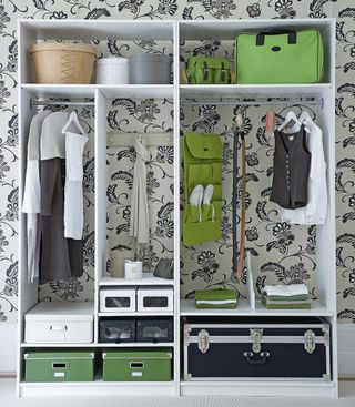 organizing pots and cloths on wardrobe