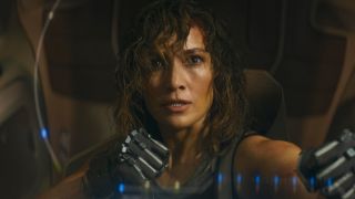 Jennifer Lopez's Atlas Shepard frightened and holding her gloved fists up to fight in Atlas