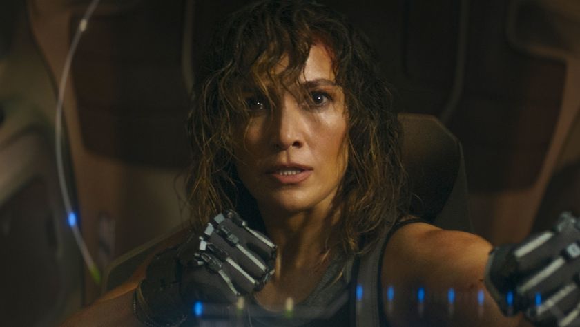 Jennifer Lopez&#039;s Atlas Shepard frightened and holding her gloved fists up to fight in Atlas