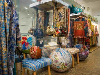 Rich textiles, clothing and upholstered furniture inside Bokja pop-up store