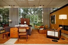 A midcentury-stlye interior with camel-toned rugs that are part of a new collection by Studio Mellone for Nordic Knots.