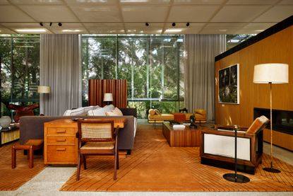 A midcentury-stlye interior with camel-toned rugs that are part of a new collection by Studio Mellone for Nordic Knots.