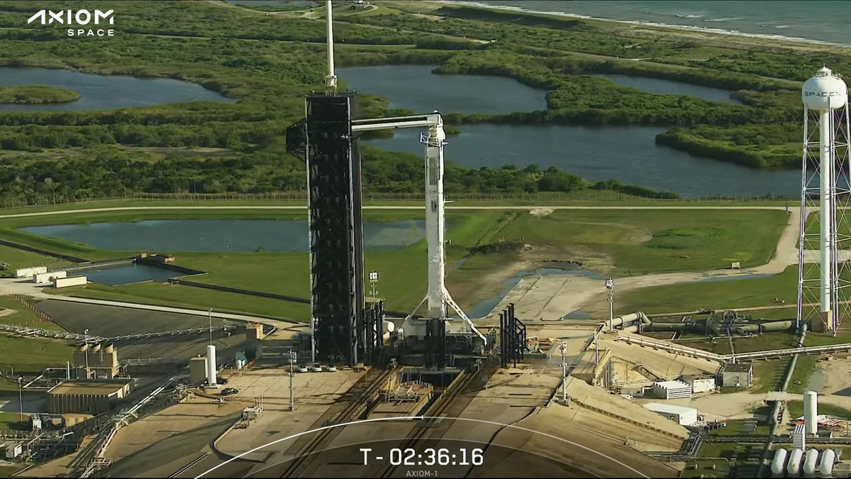 The Ax-1 rocket and capsule on the launch pad with the four astronauts at the tip.