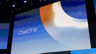 The words 'ChatDTW' shown on a blue and orange background, on a large screen in the Michelob Ultra Arena at Mandalay Bay, Las Vegas.