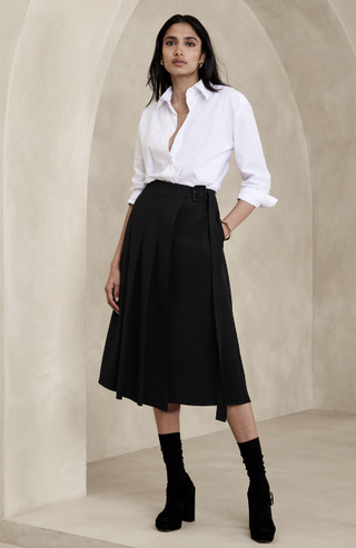A model wears a pleated skirt