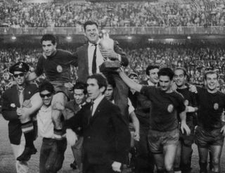 Spain players and manager José Villalonga celebrate winning the European Nations' Cup in 1964.