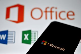 Microsoft Office logo displayed on a smartphone with app symbols in background