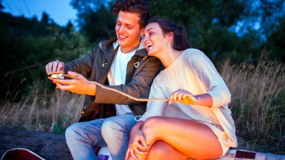 Cute young woman taking bath and having fun with her boyfriend Stock Photo