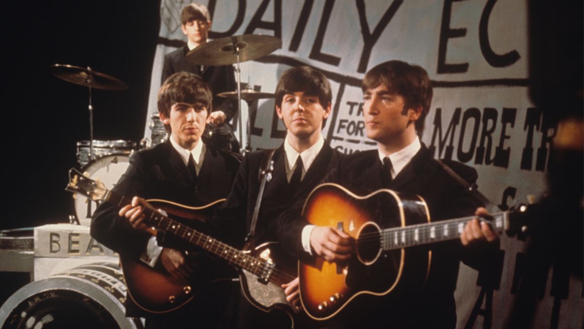 The Beatles, from left George Harrison, Ringo Starr (behind), Paul McCartney and John Lennon, perform &#039;I Want To Hold Your Hand&#039; and &#039;This Boy&#039; on Granada Television&#039;s Late Scene Extra programme at Granada television studios in Manchester, England on November 25th 1963. John Lennon is playing his Gibson J-160E guitar.