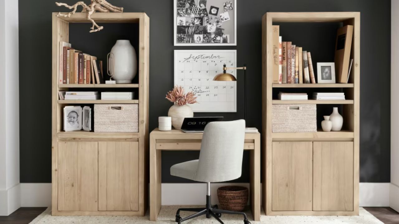 Home office with wooden bookshelves and white desk chair