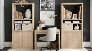 Home office with wooden bookshelves and white desk chair