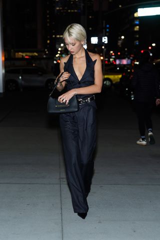 Iris Law wearing Strathberry designer bag