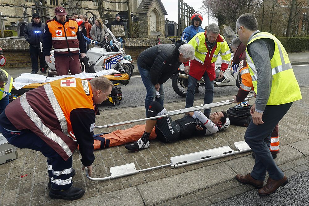 Gert Steegmans (Trek) about to be helped off the course