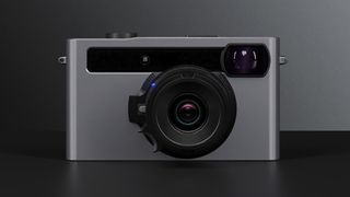 The front of the Pixii camera on a grey background