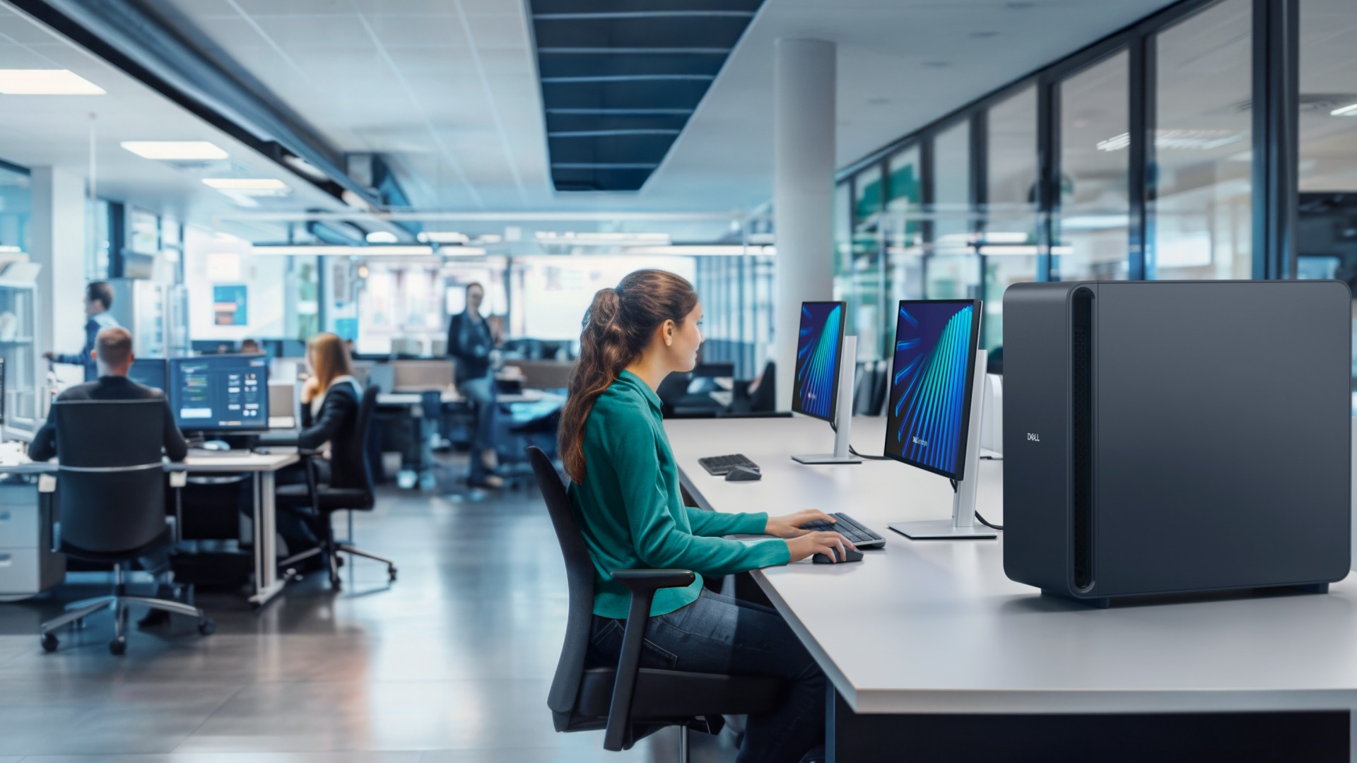 Female knowledge worker using a Dell Pro Max with GB300 desktop computer in an open place office space.